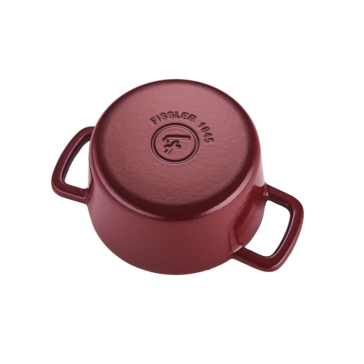 Der umgedrehte burgunderrote Fissler Moments Gusseisen Topf zeigt das Logo 1845, zwei seitliche Griffe. Präzision, Langlebigkeit - Made in Germany.