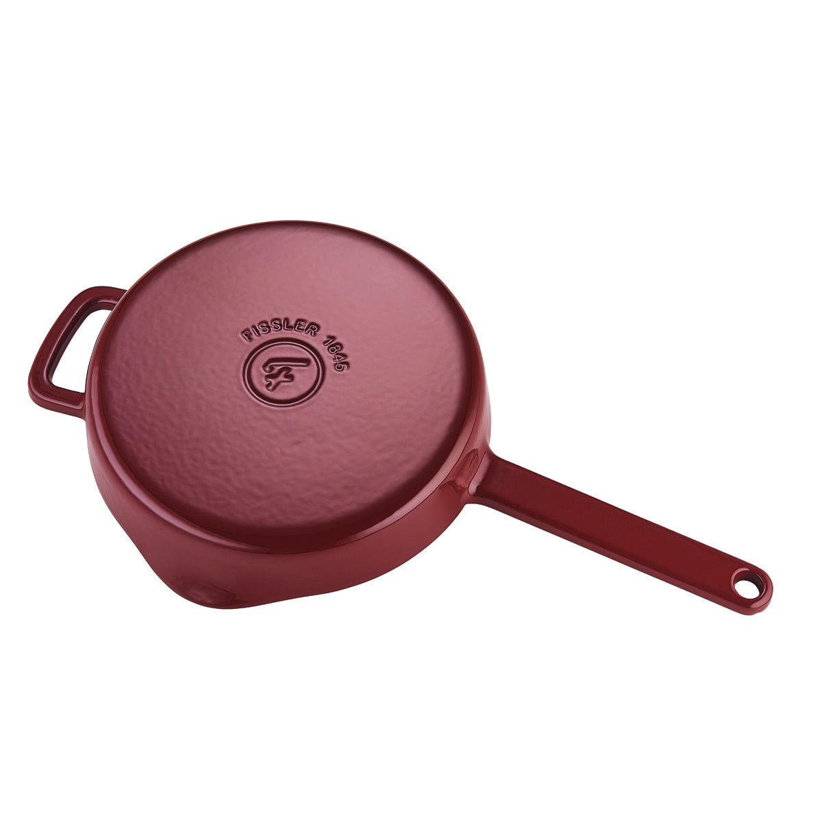 Red Moments Collection cast iron pan, upside down, with Fissler logo, 1845 Heritage Mark, and two handles for efficient cooking.