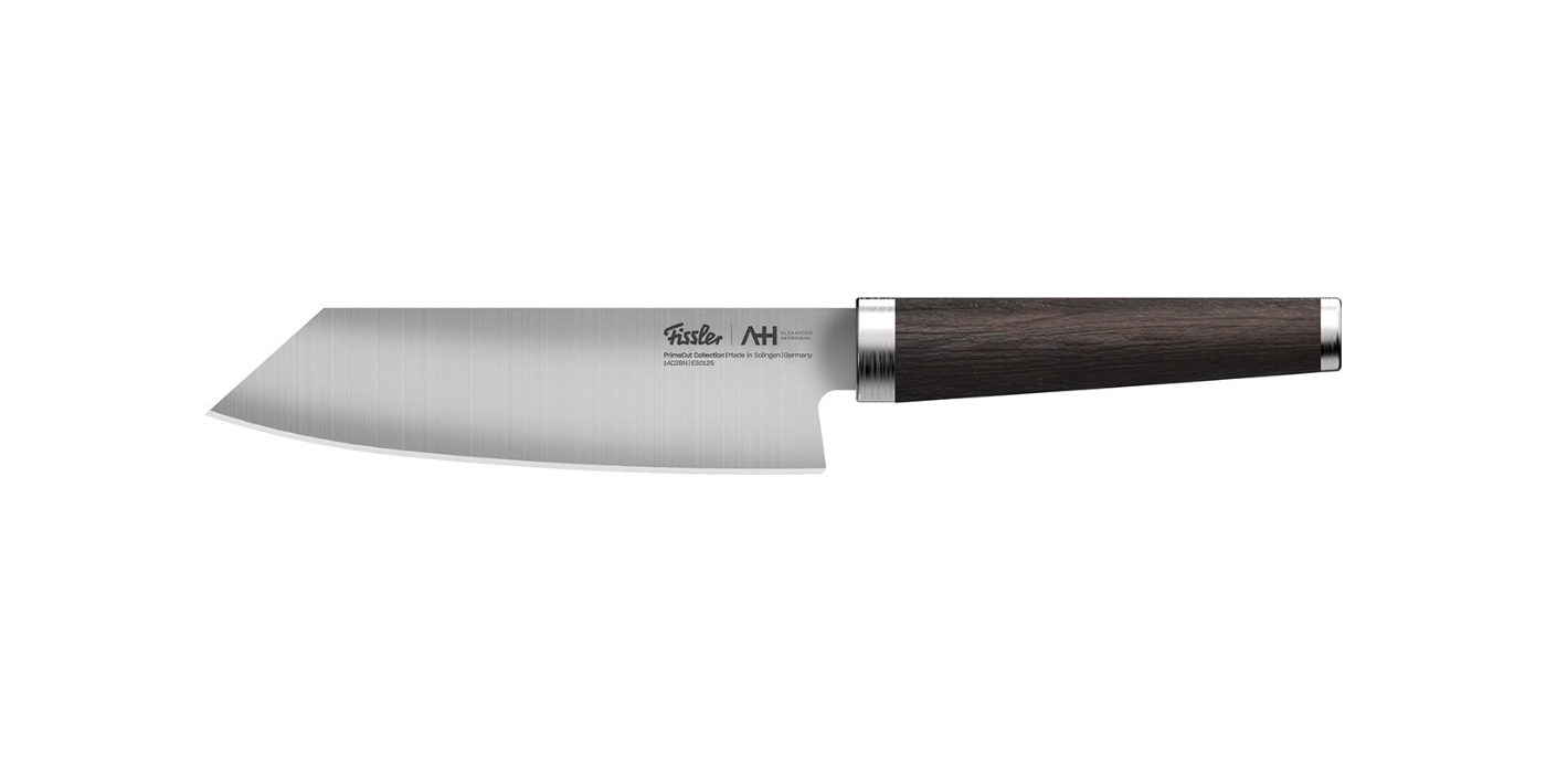 Fissler chef's knife with precision-forged stainless steel blade and dark wood handle, an example of German quality on a white background.