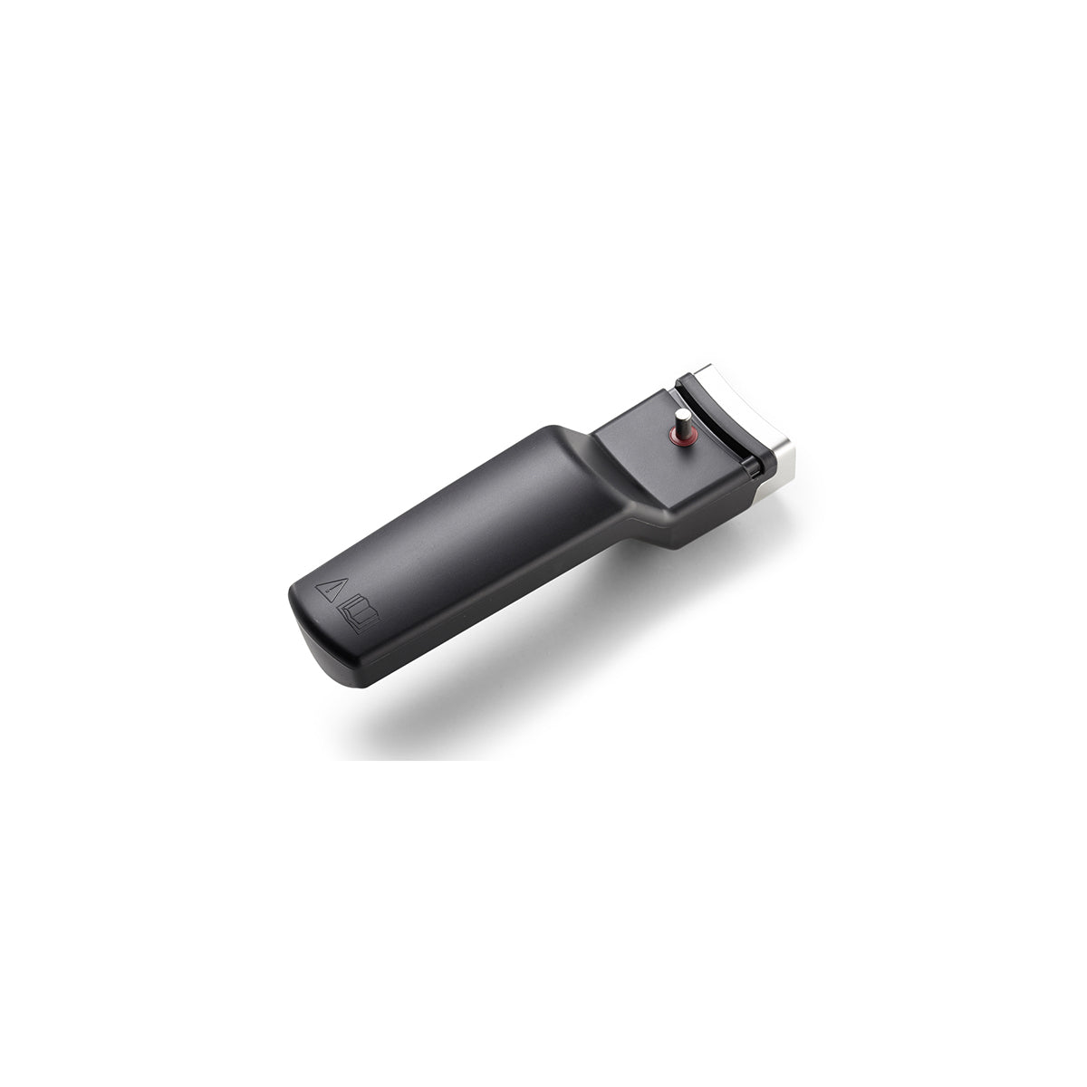 A black hair clipper next to the Fissler Vitavit® pot handle for a 26 cm rapid sauté pan, representing German quality and precision.